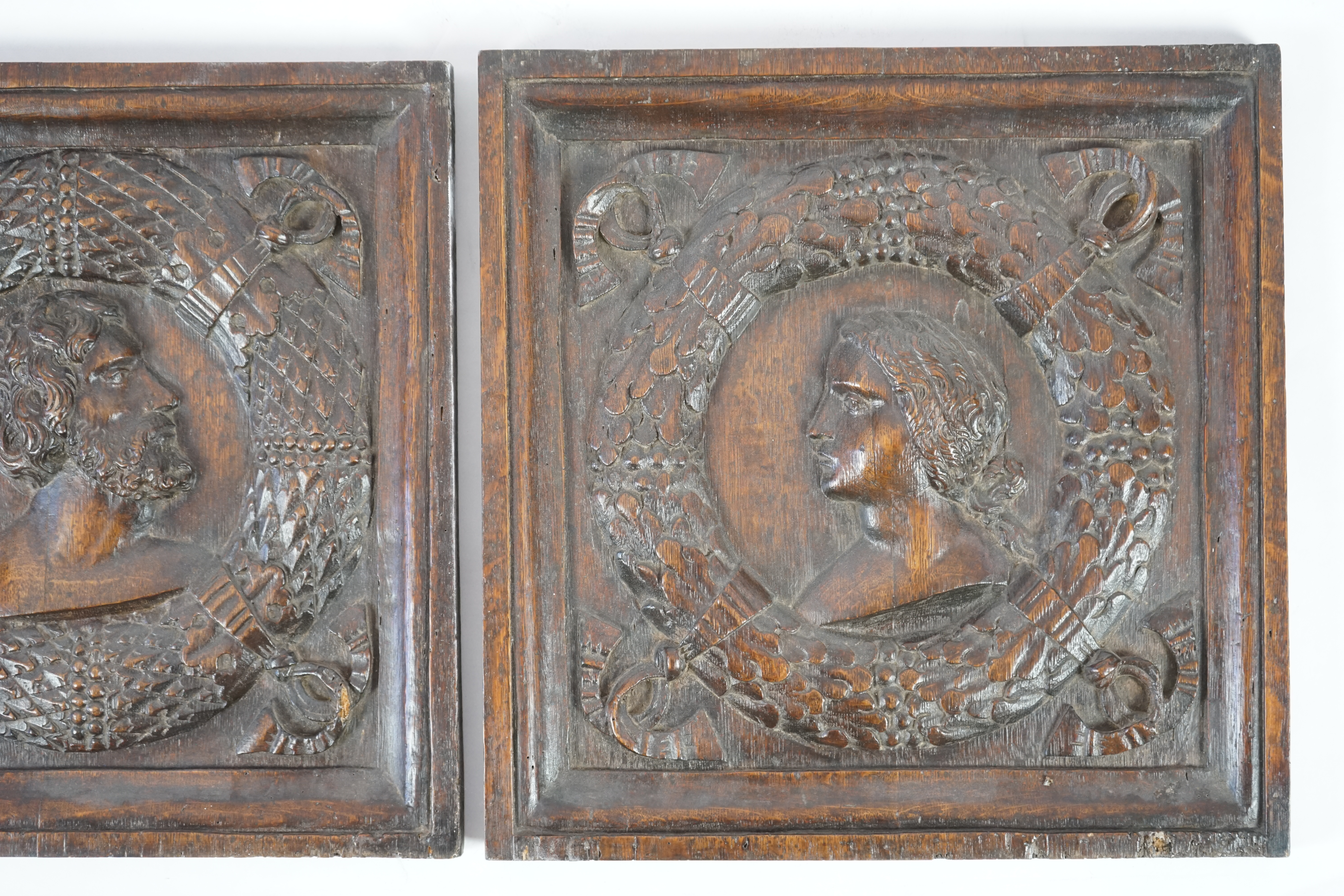 A pair of 17th century carved oak panels